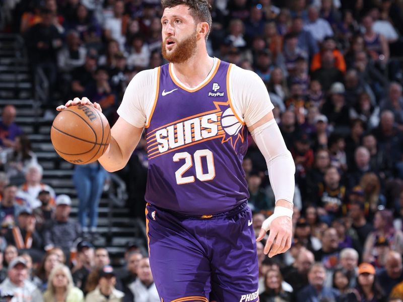 PHOENIX, AZ - MARCH 7: Jusuf Nurkic #20 of the Phoenix Suns handles the ball during the game against the Toronto Raptors on March 7, 2024 at Footprint Center in Phoenix, Arizona. NOTE TO USER: User expressly acknowledges and agrees that, by downloading and or using this photograph, user is consenting to the terms and conditions of the Getty Images License Agreement. Mandatory Copyright Notice: Copyright 2024 NBAE (Photo by Jeff Haynes/NBAE via Getty Images)