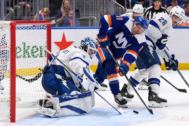 Apr 6, 2023; Elmont, New York, USA; New York Islanders left wing Zach Parise (11) attempts to score on a rebound in front of Tampa Bay Lightning goaltender Brian Elliott (1) during the second period at UBS Arena. Mandatory Credit: Dennis Schneidler-USA TODAY Sports