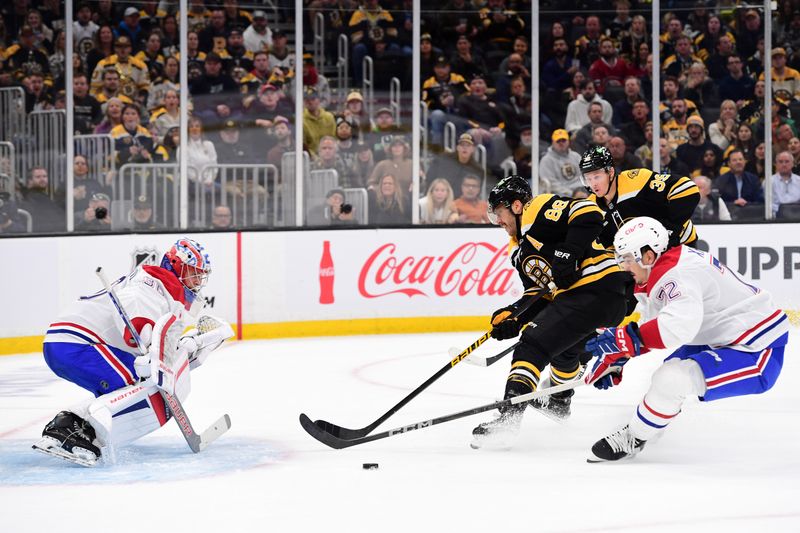 Oct 10, 2024; Boston, Massachusetts, USA;  Montreal Canadiens defenseman Arber Xhekaj (72) defends Boston Bruins right wing David Pastrnak (88) in front of goaltender Cayden Primeau (30) during the first period at TD Garden. Mandatory Credit: Bob DeChiara-Imagn Images