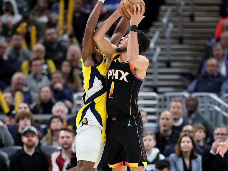 INDIANAPOLIS, INDIANA - JANUARY 26: Devin Booker #1 of the Phoenix Suns shoots the ball while defended by Aaron Nesmith #23 of the Indiana Pacers during the second half of the Pacers 133-131 win at Gainbridge Fieldhouse on January 26, 2024 in Indianapolis, Indiana.    NOTE TO USER: User expressly acknowledges and agrees that, by downloading and or using this photograph, User is consenting to the terms and conditions of the Getty Images License Agreement.  (Photo by Andy Lyons/Getty Images)