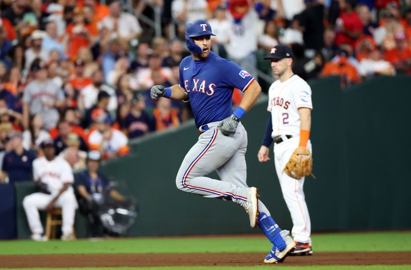 Oct 23, 2023; Houston, Texas, USA; Texas Rangers first baseman Nathaniel Lowe (30) reacts after hitting a two-run home run during the sixth inning of game seven in the ALCS against the Houston Astros for the 2023 MLB playoffs at Minute Maid Park. Mandatory Credit: Thomas Shea-USA TODAY Sports