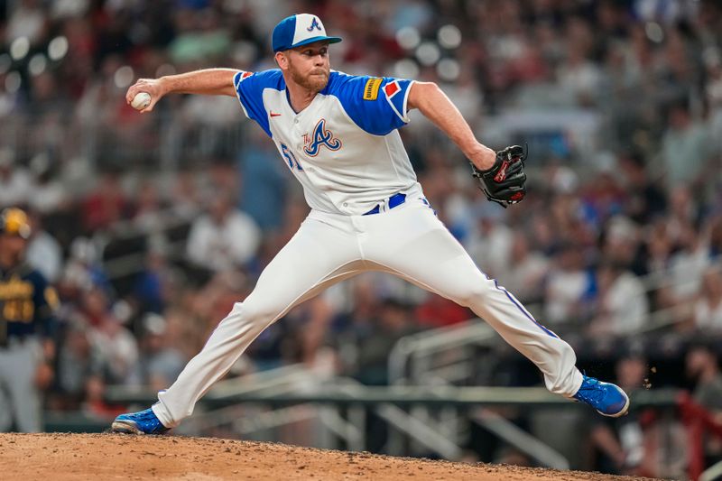 Jul 29, 2023; Cumberland, Georgia, USA; Atlanta Braves relief pitcher Michael Tonkin (51) pitches against the Milwaukee Brewers during the ninth inning at Truist Park. Mandatory Credit: Dale Zanine-USA TODAY Sports