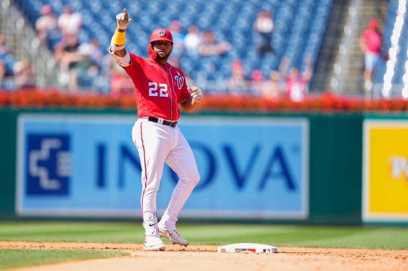 Sep 3, 2023; Washington, District of Columbia, USA;  Washington Nationals first baseman Dominic Smith (22) reacts to hitting a RBI double against the Miami Marlins during the fifth inning at Nationals Park. Mandatory Credit: Gregory Fisher-USA TODAY Sports