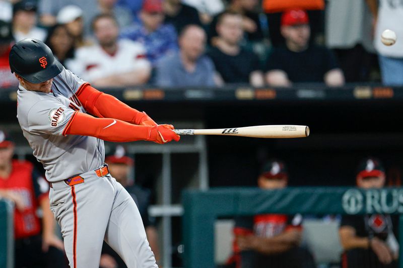 Jun 27, 2025; Chicago, Illinois, USA; San Francisco Giants catcher Patrick Bailey (14) hits a two-run triple against the Chicago White Sox during the sixth inning at Rate Field. Mandatory Credit: Kamil Krzaczynski-Imagn Images