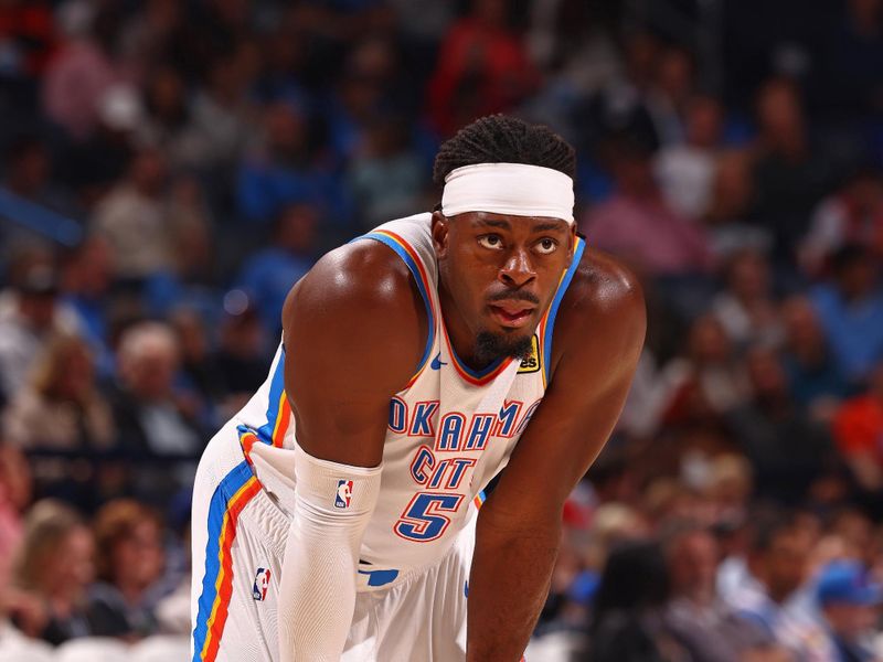 OKLAHOMA CITY, OK - FEBRUARY 23: Luguentz Dort #5 of the Oklahoma City Thunder looks on during the game against the Washington Wizards on February 23, 2024 at Paycom Arena in Oklahoma City, Oklahoma. NOTE TO USER: User expressly acknowledges and agrees that, by downloading and or using this photograph, User is consenting to the terms and conditions of the Getty Images License Agreement. Mandatory Copyright Notice: Copyright 2024 NBAE (Photo by Zach Beeker/NBAE via Getty Images)