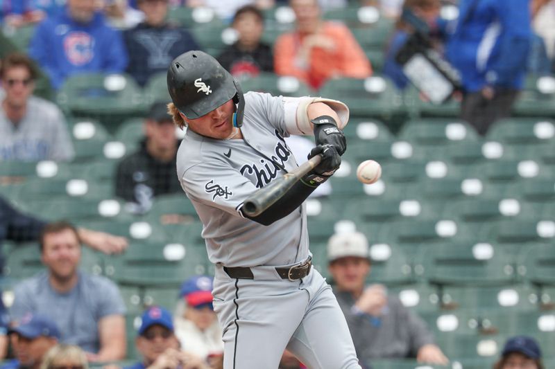 May 17, 2025; Chicago, Illinois, USA; Chicago White Sox shortstop Chase Meidroth (10) hits a solo home run against the Chicago Cubs during the first inning at Wrigley Field. Mandatory Credit: Kamil Krzaczynski-Imagn Images