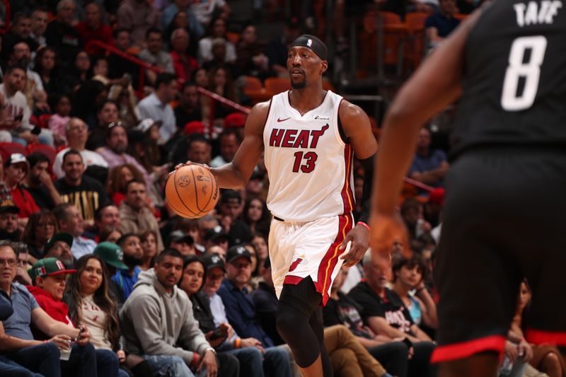 MIAMI, FL - JANUARY 8: Bam Adebayo #13 of the Miami Heat brings the ball up court against the Houston Rockets on January 8, 2024 at Kaseya Center in Miami, Florida. NOTE TO USER: User expressly acknowledges and agrees that, by downloading and or using this Photograph, user is consenting to the terms and conditions of the Getty Images License Agreement. Mandatory Copyright Notice: Copyright 2024 NBAE (Photo by Issac Baldizon/NBAE via Getty Images)