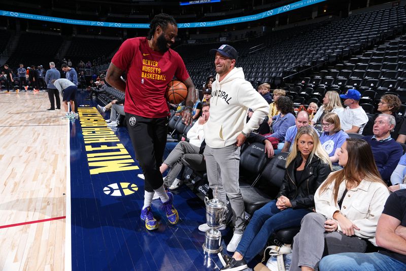 DENVER, CO - MARCH 21: DeAndre Jordan #6 of the Denver Nuggets and Wyndham Clark speak before the game against the New York Knicks on March 21, 2024 at the Ball Arena in Denver, Colorado. NOTE TO USER: User expressly acknowledges and agrees that, by downloading and/or using this Photograph, user is consenting to the terms and conditions of the Getty Images License Agreement. Mandatory Copyright Notice: Copyright 2024 NBAE (Photo by Garrett Ellwood/NBAE via Getty Images)