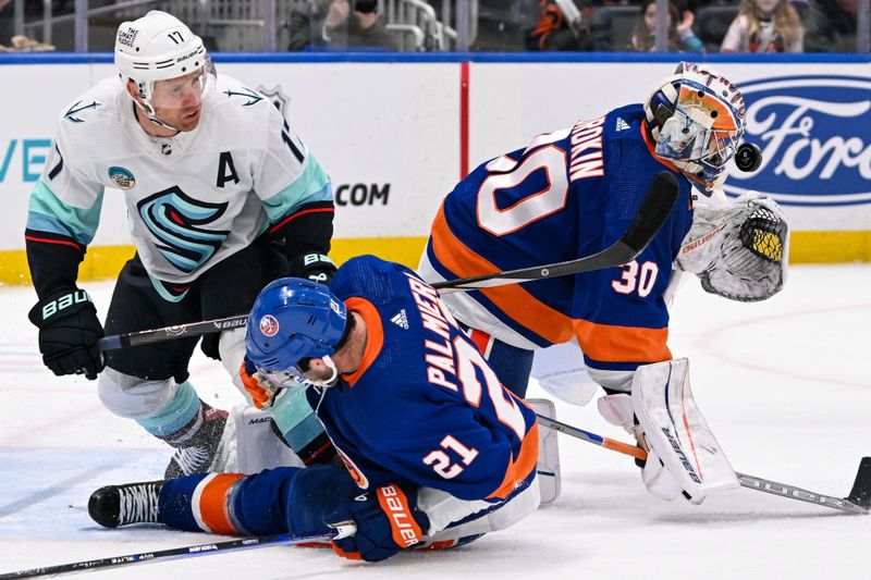 Feb 13, 2024; Elmont, New York, USA; New York Islanders goaltender Ilya Sorokin (30) makes a save in front of Seattle Kraken center Jaden Schwartz (17) and New York Islanders center Kyle Palmieri (21) during the third period at UBS Arena. Mandatory Credit: Dennis Schneidler-USA TODAY Sports