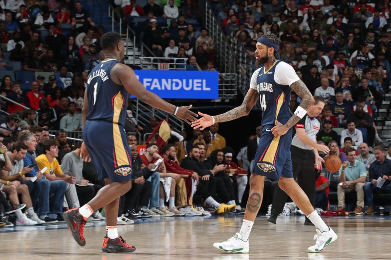 NEW ORLEANS, LA - MARCH 13: Zion Williamson #1 and Brandon Ingram #14 of the New Orleans Pelicans high five during the game against the Cleveland Cavaliers on March 13, 2024 at the Smoothie King Center in New Orleans, Louisiana. NOTE TO USER: User expressly acknowledges and agrees that, by downloading and or using this Photograph, user is consenting to the terms and conditions of the Getty Images License Agreement. Mandatory Copyright Notice: Copyright 2024 NBAE (Photo by Layne Murdoch Jr./NBAE via Getty Images)