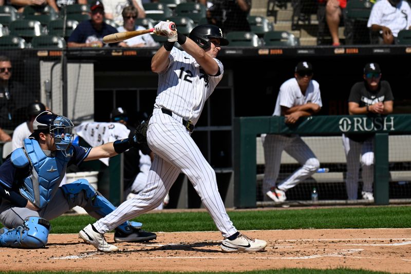 Sep 11, 2025; Chicago, Illinois, USA;  Chicago White Sox shortstop Colson Montgomery (12) hits a two-RBI single against the Tampa Bay Rays during the first inning at Rate Field. Mandatory Credit: Matt Marton-Imagn Images