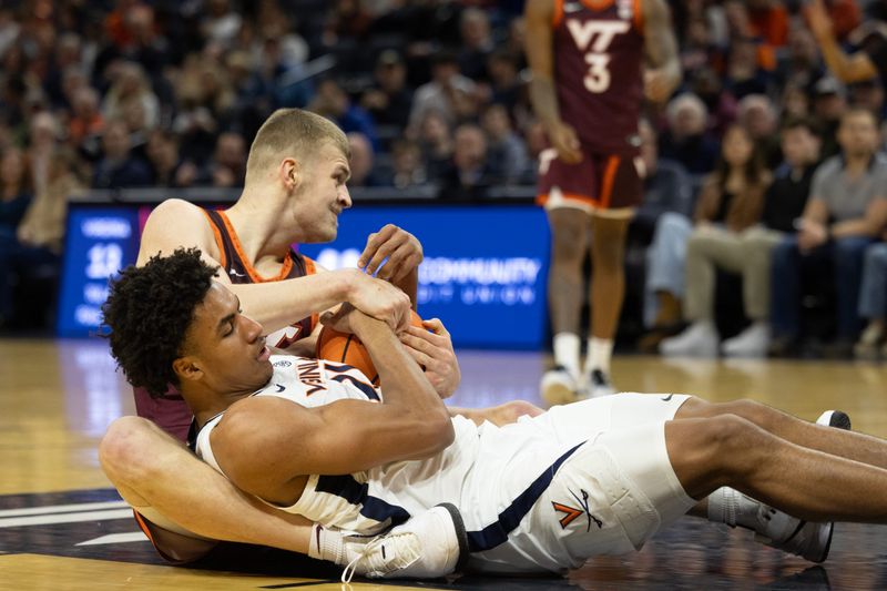 Feb 1, 2025; Charlottesville, Virginia, USA; Virginia Cavaliers forward Anthony Robinson (21) and Virginia Tech Hokies center Patrick Wessler (5) battle for the ball in the first half at John Paul Jones Arena. Mandatory Credit: Emily Morgan-Imagn Images