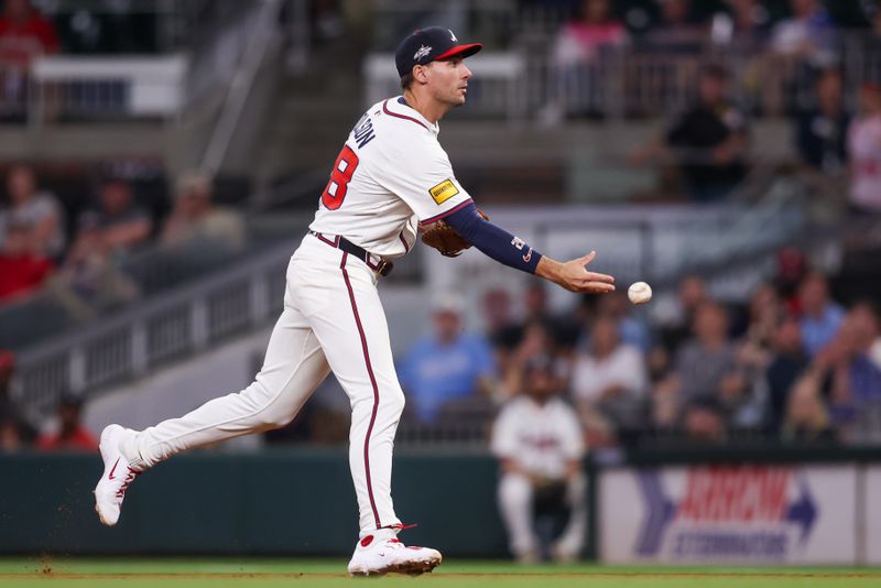May 12, 2025; Atlanta, Georgia, USA; Atlanta Braves first baseman Matt Olson (28) pitches the ball to first for an out against the Washington Nationals in the ninth inning at Truist Park. Mandatory Credit: Brett Davis-Imagn Images

