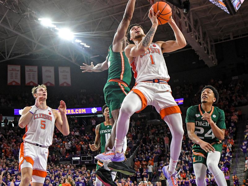 Feb 4, 2023; Clemson, South Carolina, USA; Clemson junior guard Chase Hunter (1) shoots near Miami guard Nijel Pack (24) during the second half at Littlejohn Coliseum in Clemson, S.C. Saturday, Feb. 4, 2023.   Mandatory Credit: Ken Ruinard-USA TODAY Sports