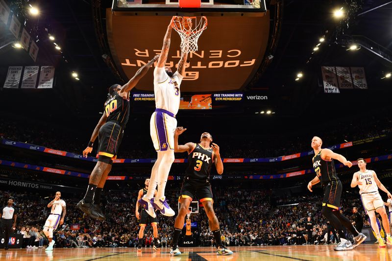 PHOENIX, AZ - NOVEMBER 26: Anthony Davis #3 of the Los Angeles Lakers dunks the ball during the game against the Phoenix Suns during the Emirates NBA Cup game on November 26, 2024 at Footprint Center in Phoenix, Arizona. NOTE TO USER: User expressly acknowledges and agrees that, by downloading and or using this photograph, user is consenting to the terms and conditions of the Getty Images License Agreement. Mandatory Copyright Notice: Copyright 2024 NBAE (Photo by Barry Gossage/NBAE via Getty Images)