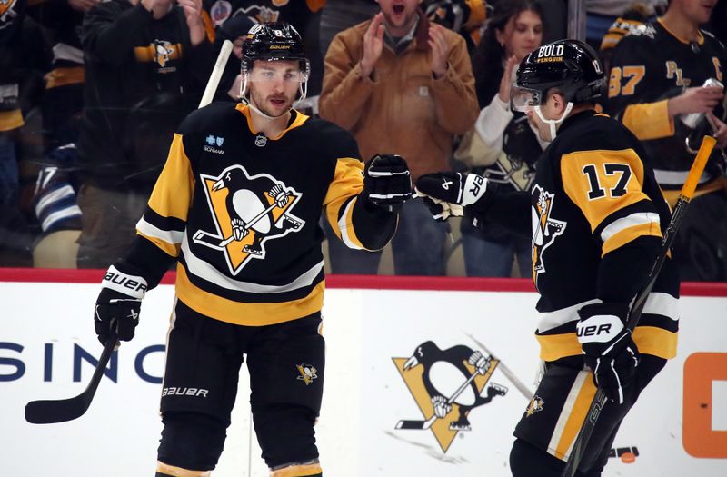 Nov 22, 2024; Pittsburgh, Pennsylvania, USA; Pittsburgh Penguins left wing Michael Bunting (8) celebrates his goal with right wing Bryan Rust (17) against the Winnipeg Jets during the third period at PPG Paints Arena. Mandatory Credit: Charles LeClaire-Imagn Images