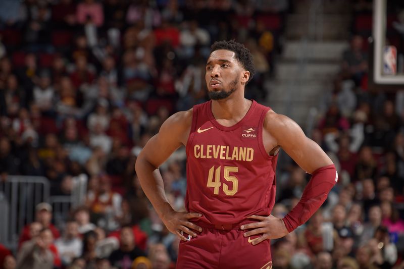 CLEVELAND, OH - FEBRUARY 14: Donovan Mitchell #45 of the Cleveland Cavaliers looks on during the game against the Chicago Bulls on February 14, 2024 at Rocket Mortgage FieldHouse in Cleveland, Ohio. NOTE TO USER: User expressly acknowledges and agrees that, by downloading and/or using this Photograph, user is consenting to the terms and conditions of the Getty Images License Agreement. Mandatory Copyright Notice: Copyright 2024 NBAE (Photo by David Liam Kyle/NBAE via Getty Images)