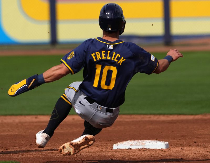 Feb 24, 2024; Peoria, Arizona, USA; Milwaukee Brewers outfielder Sal Frelick (10) steals second base against the San Diego Padres during the second inning of a Spring Training game at Peoria Sports Complex. Mandatory Credit: Joe Camporeale-USA TODAY Sports