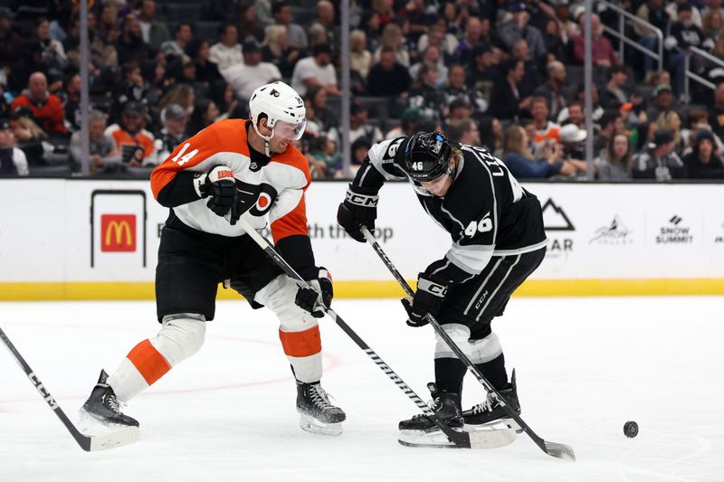 Nov 11, 2023; Los Angeles, California, USA;  Philadelphia Flyers center Sean Couturier (14) and Los Angeles Kings center Blake Lizotte (46) battle for the puck during the third period at Crypto.com Arena. Mandatory Credit: Kiyoshi Mio-USA TODAY Sports