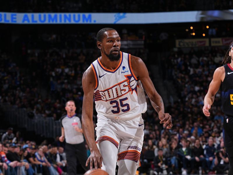 DENVER, CO - MARCH 27: Kevin Durant #35 of the Phoenix Suns handles the ball during the game  on March 27, 2024 at the Ball Arena in Denver, Colorado. NOTE TO USER: User expressly acknowledges and agrees that, by downloading and/or using this Photograph, user is consenting to the terms and conditions of the Getty Images License Agreement. Mandatory Copyright Notice: Copyright 2024 NBAE (Photo by Bart Young/NBAE via Getty Images)