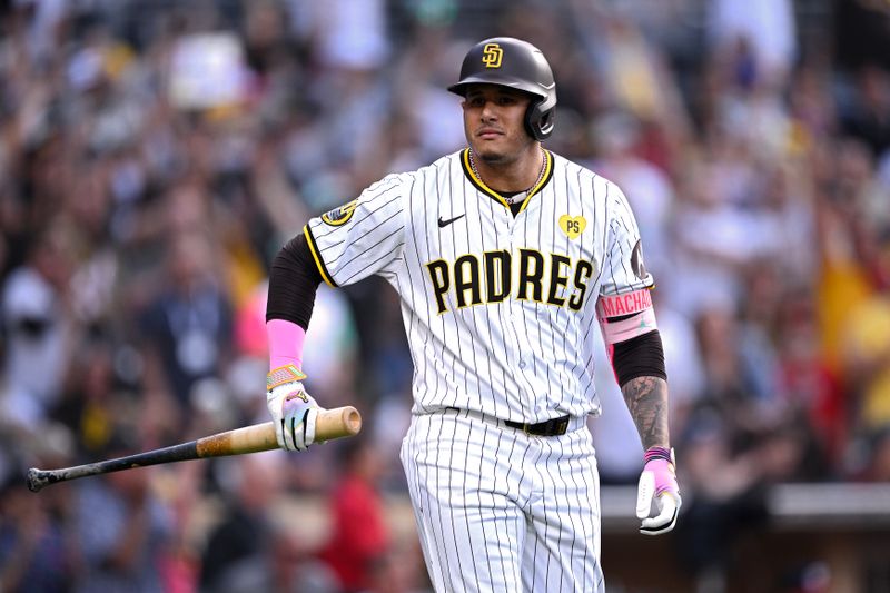 Jun 25, 2024; San Diego, California, USA; San Diego Padres third baseman Manny Machado (13) tosses his bat after hitting a two-run home run against the Washington Nationals during the first inning at Petco Park. Mandatory Credit: Orlando Ramirez-USA TODAY Sports