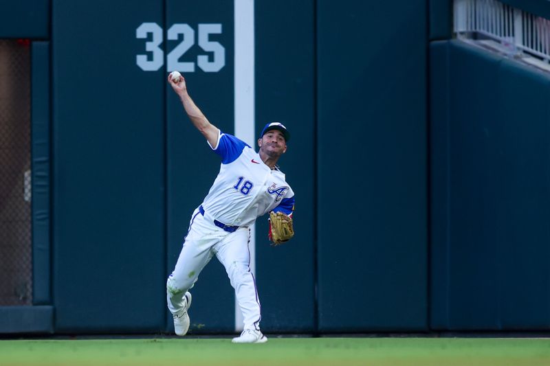 Aug 24, 2024; Atlanta, Georgia, USA; Atlanta Braves right fielder Ramon Laureano (18) throws the ball against the Washington Nationals in the second inning at Truist Park. Mandatory Credit: Brett Davis-USA TODAY Sports
