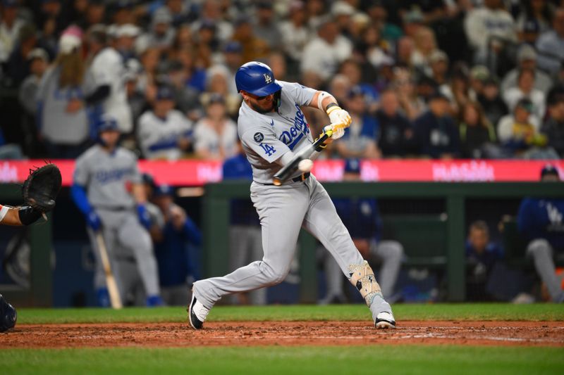 Sep 27, 2025; Seattle, Washington, USA; Los Angeles Dodgers second baseman Miguel Rojas (72) hits a double against the Seattle Mariners during the fifth inning at T-Mobile Park. Mandatory Credit: Steven Bisig-Imagn Images