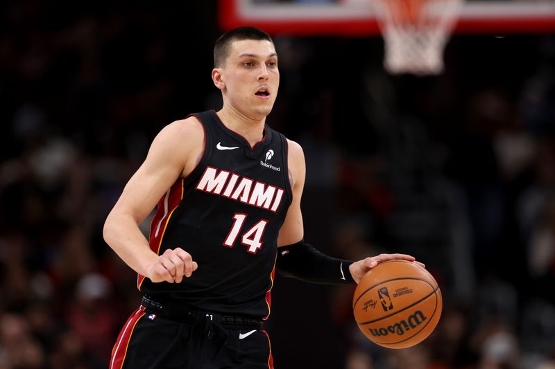 CHICAGO, ILLINOIS - FEBRUARY 04: Tyler Herro #14 of the Miami Heat in action against the Chicago Bulls at the United Center on February 04, 2025 in Chicago, Illinois. NOTE TO USER: User expressly acknowledges and agrees that, by downloading and or using this photograph, user is consenting to the terms and conditions of the Getty Images License Agreement.  (Photo by Luke Hales/Getty Images)