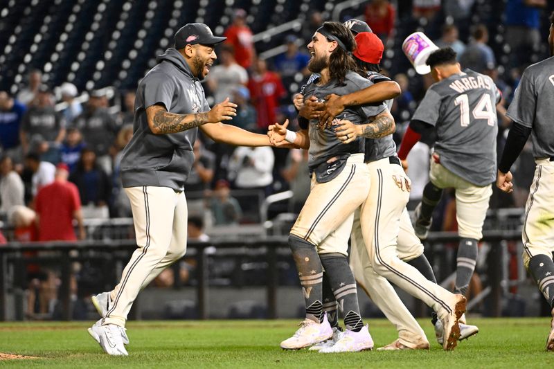 Sep 9, 2023; Washington, District of Columbia, USA; Washington Nationals second baseman Michael Chavis (6) is congratulated by first baseman Dominic Smith (22) and shortstop CJ Abrams (5) after scoring the winning run against the Los Angeles Dodgers during the eleventh inning at Nationals Park. Mandatory Credit: Brad Mills-USA TODAY Sports