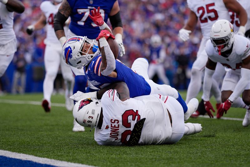 Buffalo Bills wide receiver Khalil Shakir, top, dives for the endzone for a touchdown as Arizona Cardinals defensive tackle Justin Jones is unable to make the tackle during the second half of an NFL football game Sunday, Sept. 8, 2024, in Orchard Park, N.Y. (AP Photo/Matt Slocum)