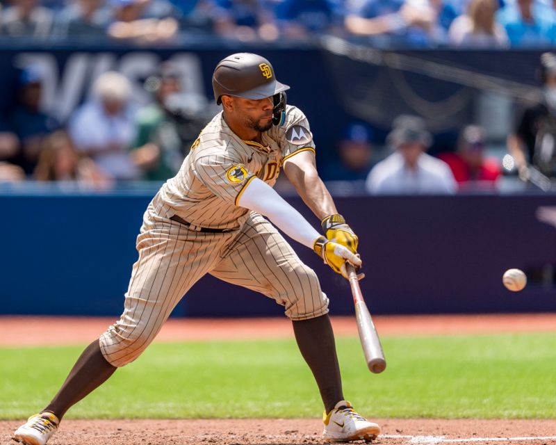 Jul 20, 2023; Toronto, Ontario, CAN; San Diego Padres shortstop Xander Bogaerts (2) bats his 1500th hit during the sixth inning against the Toronto Blue Jays at Rogers Centre. Mandatory Credit: Kevin Sousa-USA TODAY Sports