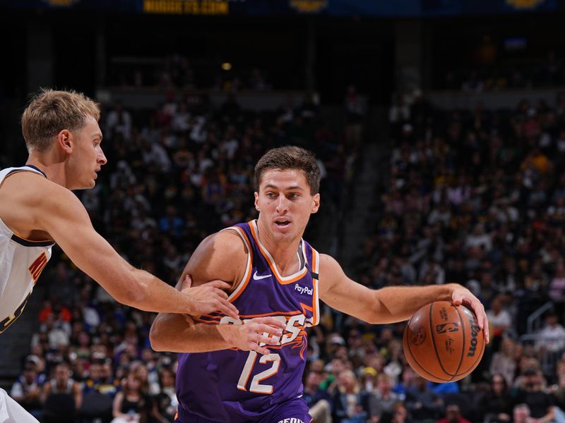 DENVER, CO - OCTOBER 13: Collin Gillespie #12 of the Phoenix Suns drives to the basket during the game against the Denver Nuggets on October 13, 2024 at Ball Arena in Denver, Colorado. NOTE TO USER: User expressly acknowledges and agrees that, by downloading and/or using this Photograph, user is consenting to the terms and conditions of the Getty Images License Agreement. Mandatory Copyright Notice: Copyright 2024 NBAE (Photo by Garrett Ellwood/NBAE via Getty Images)