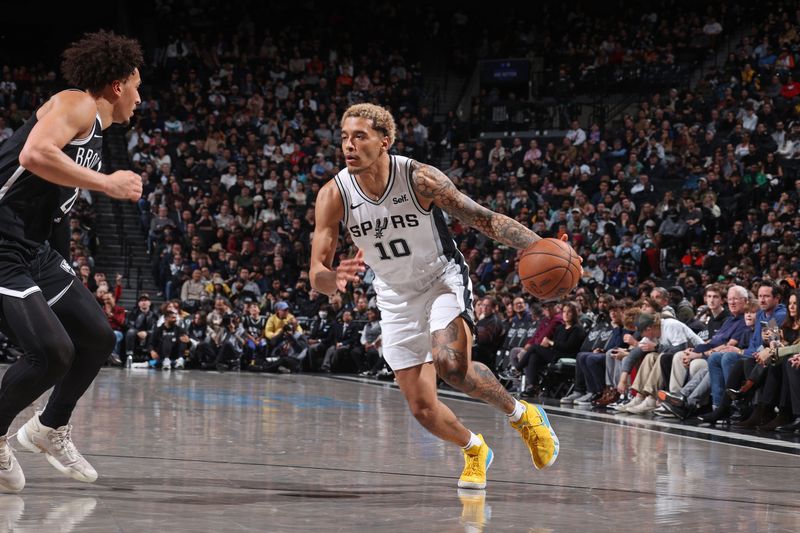 BROOKLYN, NY - FEBRUARY 10: Jeremy Sochan #10 of the San Antonio Spurs handles the ball during the game against the Brooklyn Nets on February 10, 2024 at Barclays Center in Brooklyn, New York. NOTE TO USER: User expressly acknowledges and agrees that, by downloading and or using this Photograph, user is consenting to the terms and conditions of the Getty Images License Agreement. Mandatory Copyright Notice: Copyright 2024 NBAE (Photo by Nathaniel S. Butler/NBAE via Getty Images)