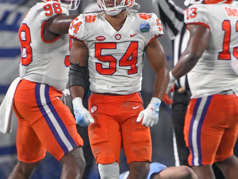 Dec 3, 2022; Charlotte, NC, USA; Clemson Tigers linebacker Jeremiah Trotter Jr. (54) gets up after tackling North Carolina Tar Heels quarterback Drake Maye (10) during the second quarter of the ACC Championship game at Bank of America Stadium. Mandatory Credit: Ken Ruinard-USA TODAY NETWORK