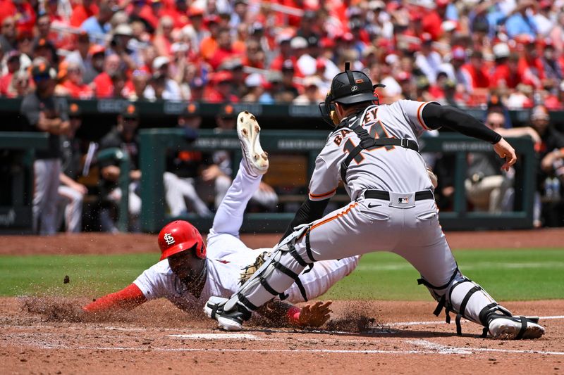 Jun 14, 2023; St. Louis, Missouri, USA;  St. Louis Cardinals left fielder Jordan Walker (18) is tagged out at home by San Francisco Giants catcher Patrick Bailey (14) during the third inning at Busch Stadium. Mandatory Credit: Jeff Curry-USA TODAY Sports