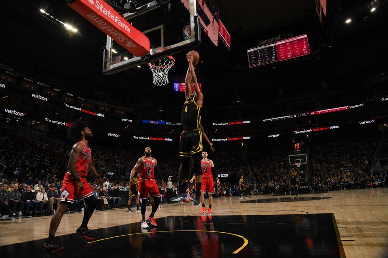 SAN FRANCISCO, CA - MARCH 7:  Moses Moody #4 of the Golden State Warriors drives to the basket during the game against the Chicago Bulls on March 7, 2024 at Chase Center in San Francisco, California. NOTE TO USER: User expressly acknowledges and agrees that, by downloading and or using this photograph, user is consenting to the terms and conditions of Getty Images License Agreement. Mandatory Copyright Notice: Copyright 2024 NBAE (Photo by Noah Graham/NBAE via Getty Images)