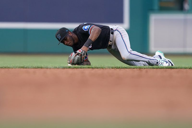 Jun 14, 2024; Washington, District of Columbia, USA; Miami Marlins shortstop Tim Anderson (7) makes an error while catching the ball in the third inning against the Washington Nationals at Nationals Park. Mandatory Credit: Amber Searls-USA TODAY Sports