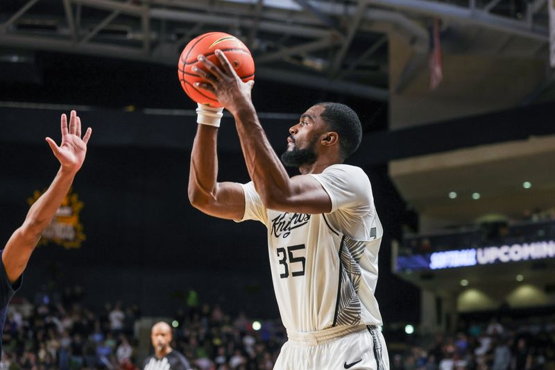 Feb 14, 2026; Orlando, Florida, USA; UCF Knights forward Devan Cambridge (35) shoots during the second half against the West Virginia Mountaineers at Addition Financial Arena. Mandatory Credit: Mike Watters-Imagn Images
