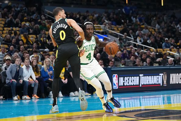 INDIANAPOLIS, INDIANA - DECEMBER 04: Jrue Holiday #4 of the Boston Celtics dribbles the ball while being guarded by Tyrese Haliburton #0 of the Indiana Pacers in the first quarter during the NBA In-Season Tournament at Gainbridge Fieldhouse on December 04, 2023 in Indianapolis, Indiana. NOTE TO USER: User expressly acknowledges and agrees that, by downloading and or using this photograph, User is consenting to the terms and conditions of the Getty Images License Agreement. (Photo by Dylan Buell/Getty Images)