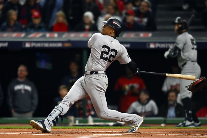 Oct 18, 2024; Cleveland, Ohio, USA; New York Yankees outfielder Juan Soto (22) hits a two run home run against the Cleveland Guardians in the first inning during game four of the ALCS for the 2024 MLB playoffs at Progressive Field. Mandatory Credit: Ken Blaze-Imagn Images