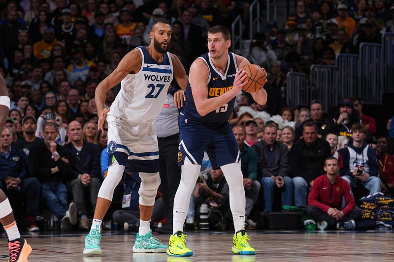 DENVER, CO - APRIL 10: Rudy Gobert #27 of the Minnesota Timberwolves plays defense against Nikola Jokic #15 of the Denver Nuggets during the game on April 10, 2024 at the Ball Arena in Denver, Colorado. NOTE TO USER: User expressly acknowledges and agrees that, by downloading and/or using this Photograph, user is consenting to the terms and conditions of the Getty Images License Agreement. Mandatory Copyright Notice: Copyright 2024 NBAE (Photo by Bart Young/NBAE via Getty Images)