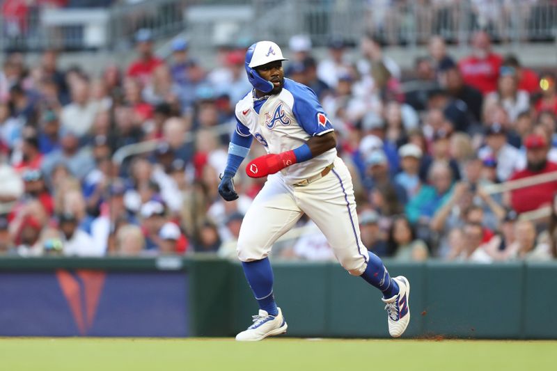 Apr 20, 2024; Cumberland, Georgia, USA; Atlanta Braves center fielder Michael Harris II (23) runs to second base in a game against the Texas Rangers in the first inning at Truist Park. Mandatory Credit: Mady Mertens-USA TODAY Sports