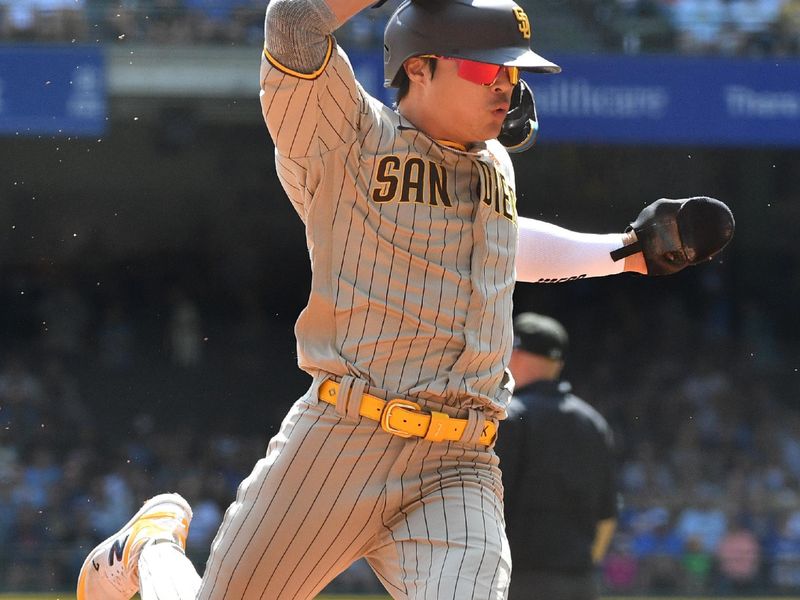 Aug 27, 2023; Milwaukee, Wisconsin, USA; San Diego Padres second baseman Ha-Seong Kim (7) runs from first to third base against the Milwaukee Brewers in the first inning at American Family Field. Mandatory Credit: Michael McLoone-USA TODAY Sports