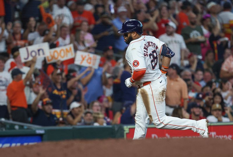 Aug 20, 2024; Houston, Texas, USA; Fans hold signs as Houston Astros first baseman Jon Singleton (28) rounds the bases after hitting a home run during the first inning against the Boston Red Sox at Minute Maid Park. Mandatory Credit: Troy Taormina-USA TODAY Sports