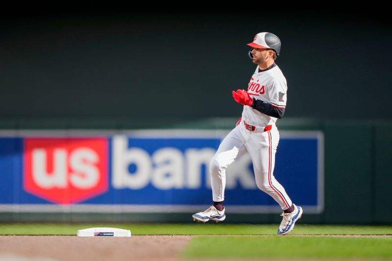 Apr 4, 2024; Minneapolis, Minnesota, USA; Minnesota Twins second baseman Edouard Julien (47) hits a solo home run during the fifth inning against the Cleveland Guardians at Target Field. Mandatory Credit: Jordan Johnson-USA TODAY Sports