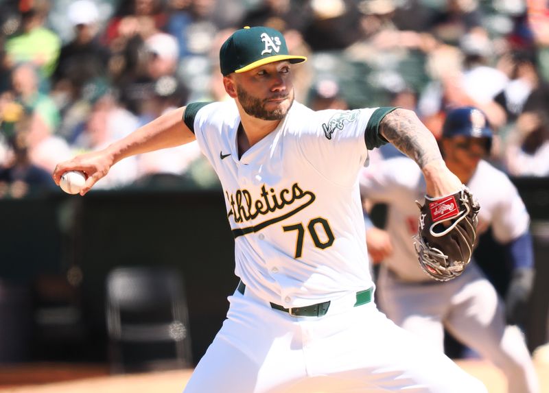 May 25, 2024; Oakland, California, USA; Oakland Athletics relief pitcher Lucas Erceg (70) pitched the ball against the Houston Astros during the seventh inning at Oakland-Alameda County Coliseum. Mandatory Credit: Kelley L Cox-USA TODAY Sports