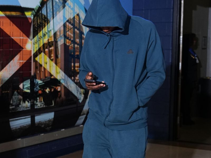 DENVER, CO - MARCH 29: Anthony Edwards #5 of the Minnesota Timberwolves arrives to the arena before the game against the Denver Nuggets on March 29, 2024 at the Ball Arena in Denver, Colorado. NOTE TO USER: User expressly acknowledges and agrees that, by downloading and/or using this Photograph, user is consenting to the terms and conditions of the Getty Images License Agreement. Mandatory Copyright Notice: Copyright 2024 NBAE (Photo by Garrett Ellwood/NBAE via Getty Images)