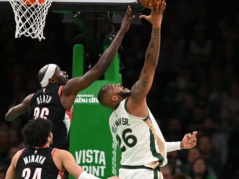 BOSTON, MASSACHUSETTS - APRIL 07: Xavier Tillman #26 of the Boston Celtics attempts a layup against Duop Reath #26 of the Portland Trail Blazers and Justin Minaya #24 during the second quarter at the TD Garden on April 07, 2024 in Boston, Massachusetts. NOTE TO USER: User expressly acknowledges and agrees that, by downloading and or using this photograph, User is consenting to the terms and conditions of the Getty Images License Agreement. (Photo by Brian Fluharty/Getty Images)