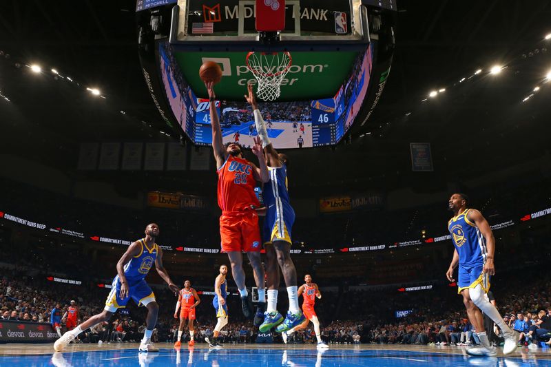 OKLAHOMA CITY, OK - NOVEMBER 10: Ajay Mitchell #25 of the Oklahoma City Thunder drives to the basket during the game against the Golden State Warriors on November 10, 2024 at Paycom Center in Oklahoma City, Oklahoma. NOTE TO USER: User expressly acknowledges and agrees that, by downloading and or using this photograph, User is consenting to the terms and conditions of the Getty Images License Agreement. Mandatory Copyright Notice: Copyright 2024 NBAE (Photo by Zach Beeker/NBAE via Getty Images)