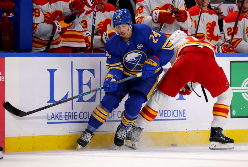 Oct 19, 2023; Buffalo, New York, USA;  Buffalo Sabres center Dylan Cozens (24) looks for the puck during the third period against the Calgary Flames at KeyBank Center. Mandatory Credit: Timothy T. Ludwig-USA TODAY Sports